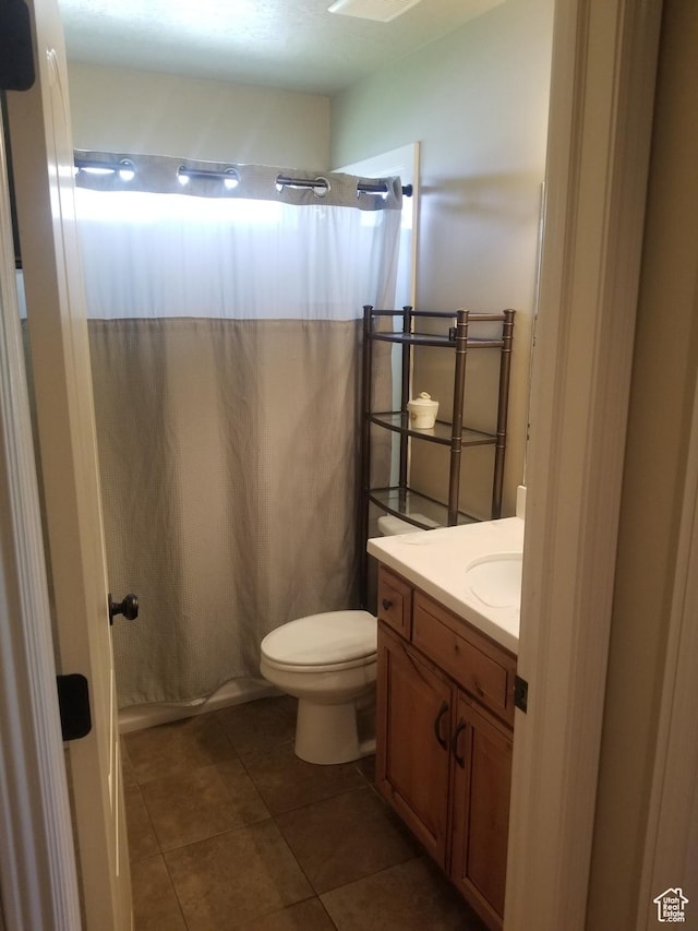 4895 W 5000 S, Hooper, UT 84315 - full bath with vanity, toilet, tile patterned flooring, and a shower with shower curtain
