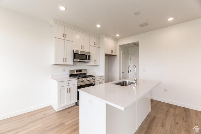 6064 W Lower Ln Unit 8-222, West Jordan, UT 84081 - kitchen featuring stainless steel appliances, a sink, baseboards, light wood-type flooring, and recessed lighting
