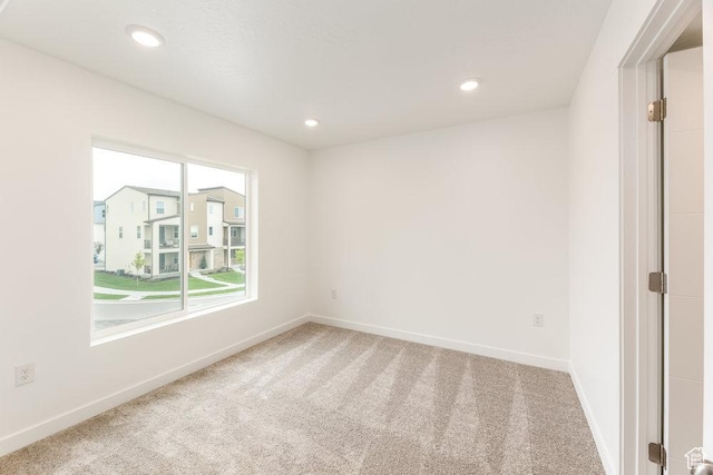 6064 W Lower Ln Unit 8-222, West Jordan, UT 84081 - empty room featuring carpet flooring, baseboards, and recessed lighting