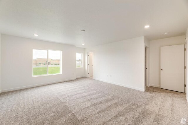 6064 W Lower Ln Unit 8-222, West Jordan, UT 84081 - unfurnished room with light colored carpet, recessed lighting, and baseboards