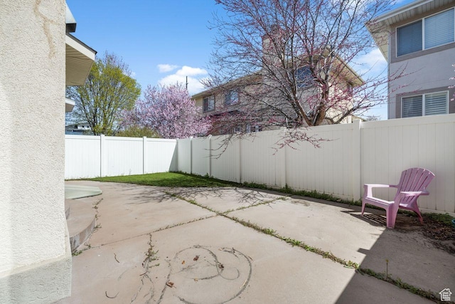 7819 S Spruce Tree Ln, Sandy, UT 84094 - fenced backyard featuring a patio