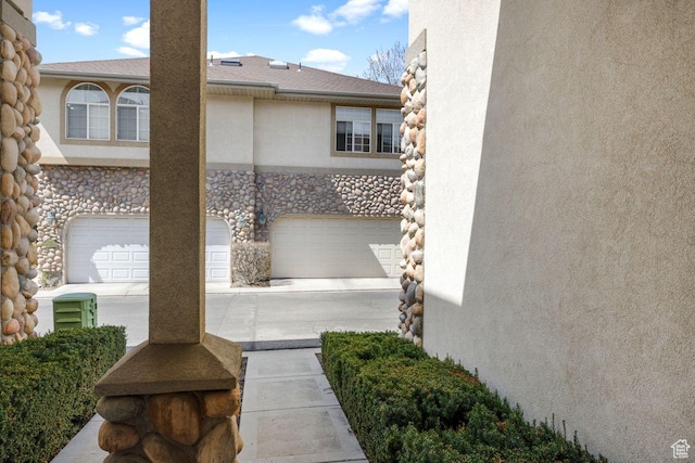 7819 S Spruce Tree Ln, Sandy, UT 84094 - view of patio / terrace with an attached garage and concrete driveway