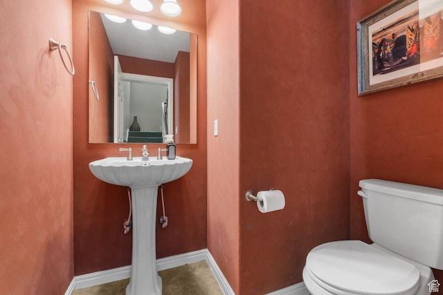 7819 S Spruce Tree Ln, Sandy, UT 84094 - bathroom with toilet and baseboards