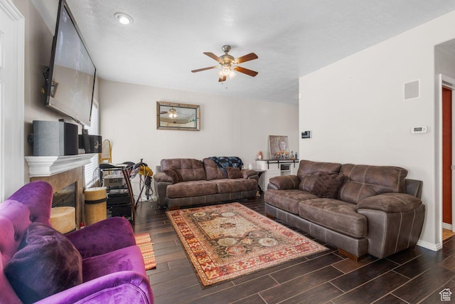 7819 S Spruce Tree Ln, Sandy, UT 84094 - living room featuring a ceiling fan, dark wood finished floors, a tile fireplace, baseboards, and recessed lighting