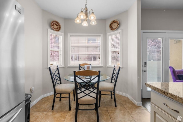 7819 S Spruce Tree Ln, Sandy, UT 84094 - dining space with a chandelier, baseboards, and light tile patterned floors