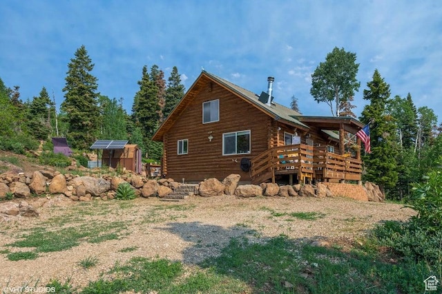 706 W Tranquility Dr, Virgin, UT 84779 - rear view of property featuring log exterior, an outdoor structure, and a deck