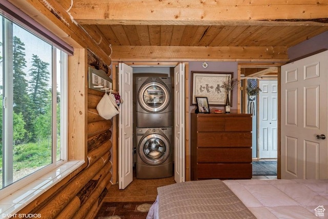 706 W Tranquility Dr, Virgin, UT 84779 - bedroom featuring stacked washer / dryer, wooden ceiling with exposed beams, log walls, and tile patterned floors