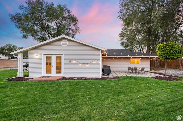 807 E Ln Dore Dr, Salt Lake City, UT 84107 - back of property at dusk featuring a patio area