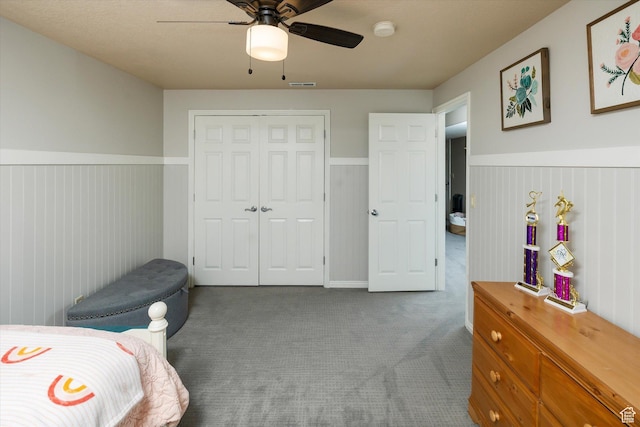 1007 E 2650 N, North Logan, UT 84341 - bedroom with wainscoting, carpet floors, a closet, and a ceiling fan