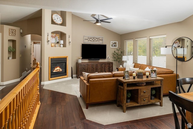 1007 E 2650 N, North Logan, UT 84341 - living area with lofted ceiling, ceiling fan, a glass covered fireplace, hardwood / wood-style flooring, and baseboards