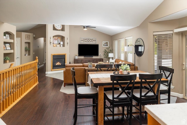 1007 E 2650 N, North Logan, UT 84341 - dining room featuring ceiling fan, lofted ceiling, a glass covered fireplace, dark wood finished floors, and baseboards