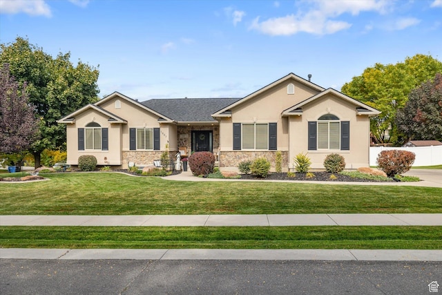 1007 E 2650 N, North Logan, UT 84341 - ranch-style home featuring stucco siding, a front yard, and stone siding