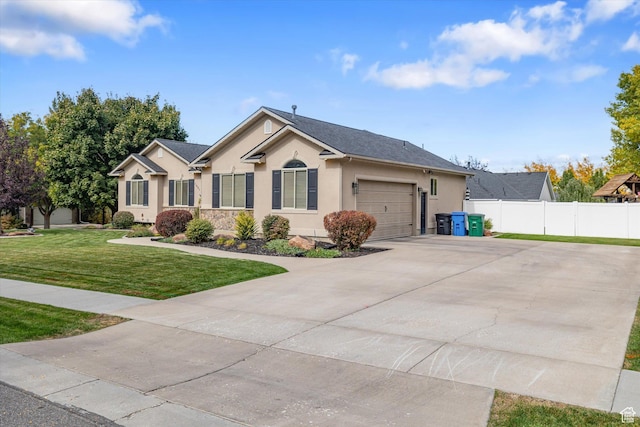 1007 E 2650 N, North Logan, UT 84341 - ranch-style home with stucco siding, driveway, and an attached garage