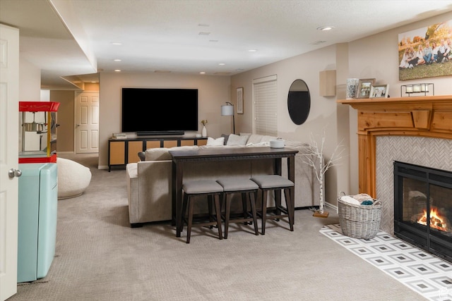 1007 E 2650 N, North Logan, UT 84341 - living area with a tiled fireplace, carpet floors, and recessed lighting