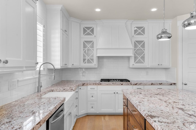 1676 W Timp Meadows Dr, Lehi, UT 84043 - kitchen featuring wall chimney exhaust hood, appliances with stainless steel finishes, white cabinets, glass insert cabinets, and recessed lighting