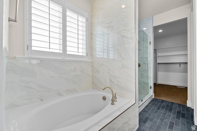 1676 W Timp Meadows Dr, Lehi, UT 84043 - full bathroom with a bath, a shower stall, a spacious closet, recessed lighting, and baseboards
