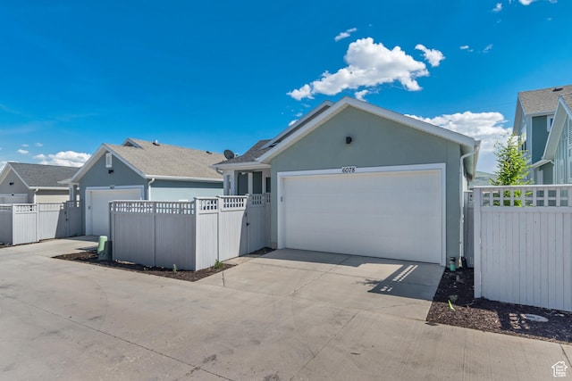 6078 W 11800 S Unit 490, South Jordan, UT 84009 - garage featuring driveway and a gate