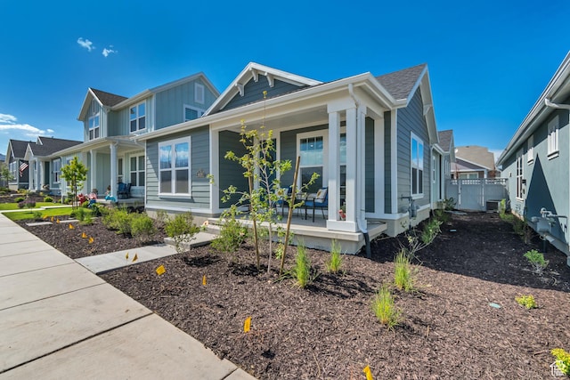 6078 W 11800 S Unit 490, South Jordan, UT 84009 - view of front of home with a porch, board and batten siding, and a residential view
