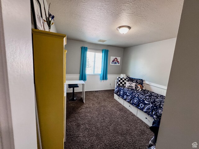 2156 E 3000 N, Layton, UT 84040 - bedroom with a textured ceiling and dark carpet
