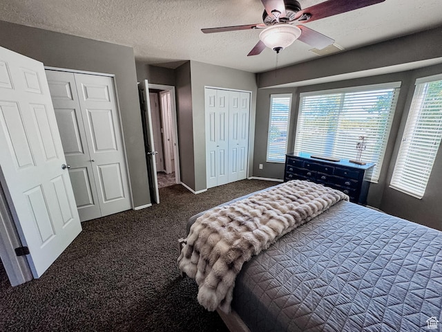 2156 E 3000 N, Layton, UT 84040 - bedroom with two closets, carpet floors, multiple windows, baseboards, and a textured ceiling