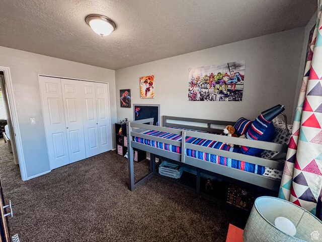 2156 E 3000 N, Layton, UT 84040 - bedroom with carpet flooring, a textured ceiling, and a closet