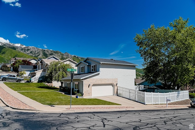 2156 E 3000 N, Layton, UT 84040 - view of home's exterior featuring an attached garage, driveway, and a mountain view