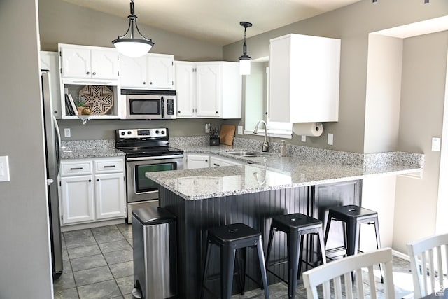 2156 E 3000 N, Layton, UT 84040 - kitchen with appliances with stainless steel finishes, a sink, a peninsula, and white cabinetry