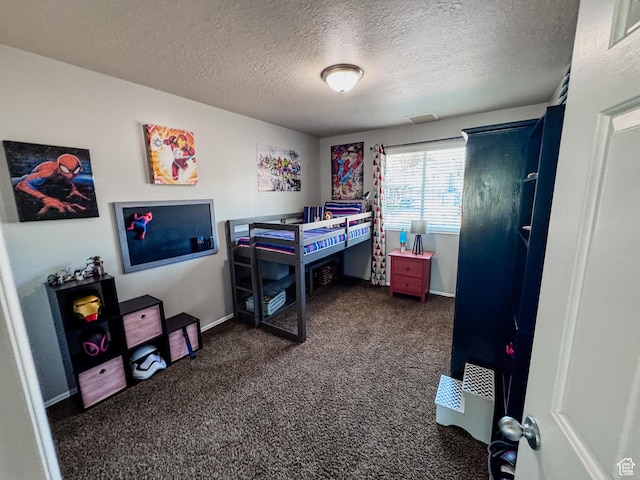 2156 E 3000 N, Layton, UT 84040 - bedroom featuring dark carpet, a textured ceiling, and baseboards