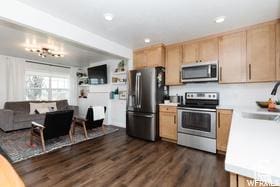 1186 W 200 S, Logan, UT 84321 - kitchen with appliances with stainless steel finishes, light brown cabinetry, a sink, dark wood-style floors, and recessed lighting