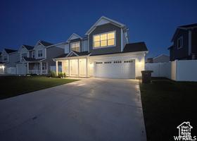 1186 W 200 S, Logan, UT 84321 - view of front of home with a garage, concrete driveway, and a residential view
