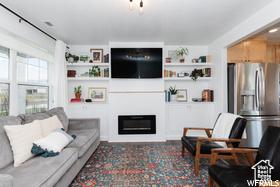 1186 W 200 S, Logan, UT 84321 - living area with a glass covered fireplace and built in features