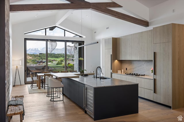 310 Red Ledges Blvd, Heber City, UT 84032 - kitchen with modern cabinets, a sink, beam ceiling, wine cooler, and a mountain view