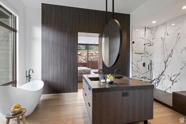310 Red Ledges Blvd, Heber City, UT 84032 - bathroom with vanity, a soaking tub, connected bathroom, wood finished floors, and recessed lighting