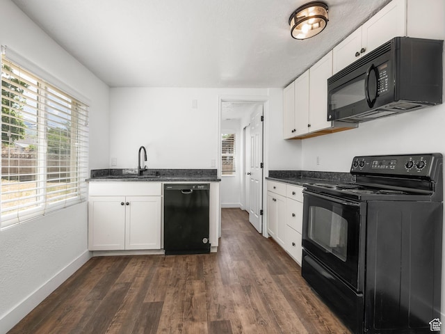 250 N 100 E, Tooele, UT 84074 - kitchen featuring black appliances, dark wood-type flooring, white cabinetry, and baseboards