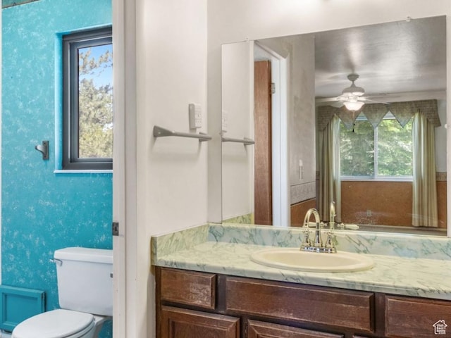 1922 E Southbridge Way, Sandy, UT 84093 - bathroom with vanity, toilet, and a ceiling fan