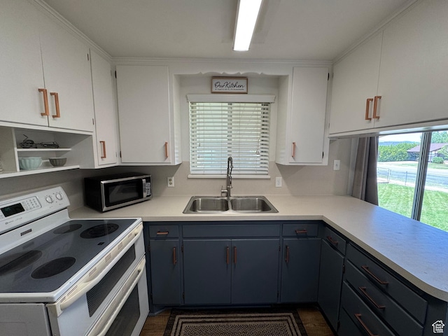 485 N 300 E, Nephi, UT 84648 - kitchen featuring white electric range, a sink, stainless steel microwave, light countertops, and white cabinets