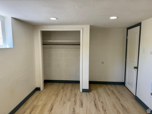 559 E Harmston Ave, Roosevelt, UT 84066 - unfurnished bedroom featuring light wood-style flooring, baseboards, and a closet