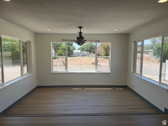 559 E Harmston Ave, Roosevelt, UT 84066 - unfurnished dining area featuring plenty of natural light, wood finished floors, a textured ceiling, a ceiling fan, and recessed lighting