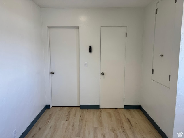559 E Harmston Ave, Roosevelt, UT 84066 - unfurnished bedroom with light wood-style flooring