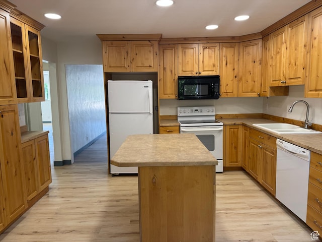 559 E Harmston Ave, Roosevelt, UT 84066 - kitchen featuring white appliances, a sink, light wood-style floors, a kitchen island, and recessed lighting
