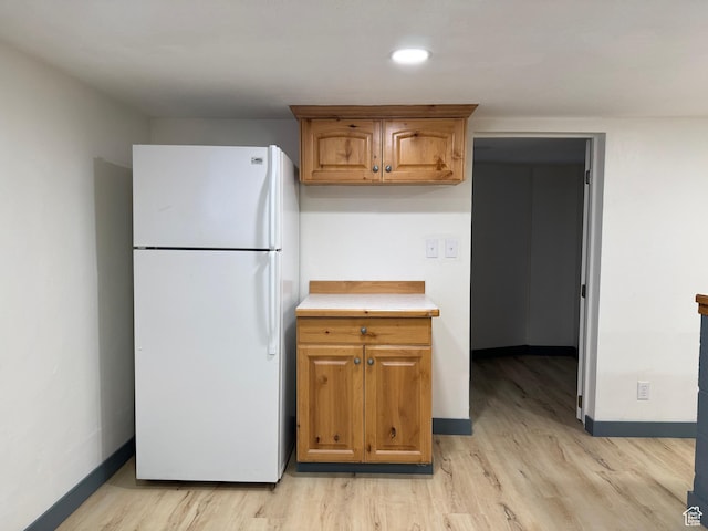 559 E Harmston Ave, Roosevelt, UT 84066 - kitchen featuring freestanding refrigerator, light wood finished floors, and baseboards