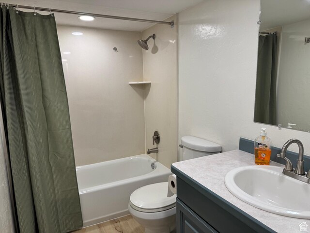 559 E Harmston Ave, Roosevelt, UT 84066 - full bath with toilet, shower / bath combo, vanity, and wood finished floors