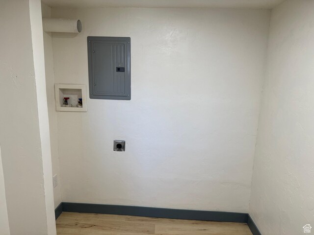 559 E Harmston Ave, Roosevelt, UT 84066 - laundry area featuring electric panel, wood finished floors, hookup for a washing machine, hookup for an electric dryer, and baseboards