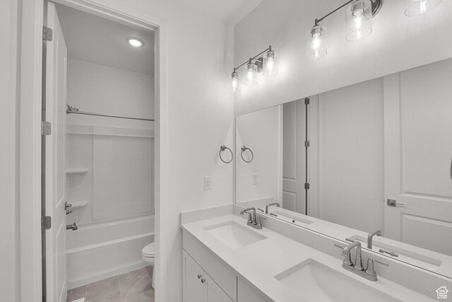 1147 N 375 W Unit 11, Harrisville, UT 84404 - bathroom featuring double vanity, toilet, and tub / shower combination