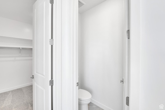 1147 N 375 W Unit 11, Harrisville, UT 84404 - bathroom featuring baseboards, toilet, and a spacious closet