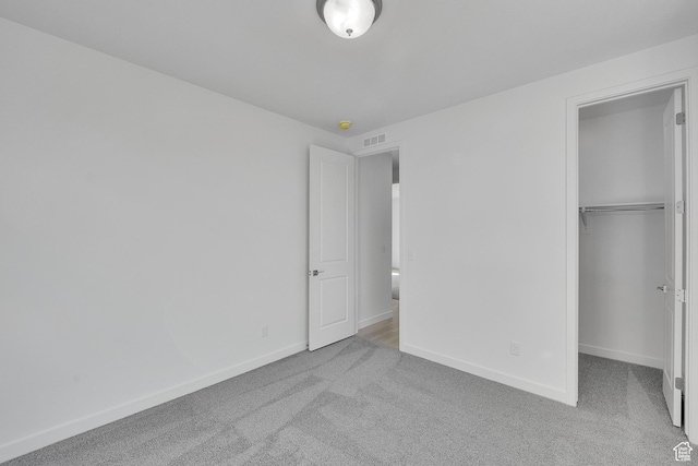 1147 N 375 W Unit 11, Harrisville, UT 84404 - unfurnished bedroom featuring carpet, baseboards, a closet, and a walk in closet