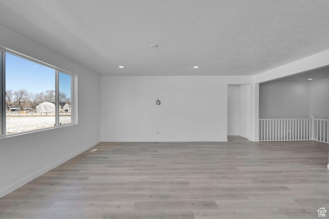 1147 N 375 W Unit 11, Harrisville, UT 84404 - empty room featuring light wood-style flooring, recessed lighting, and baseboards