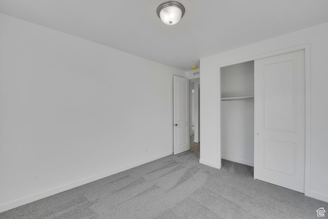 1147 N 375 W Unit 11, Harrisville, UT 84404 - unfurnished bedroom with carpet, baseboards, and a closet