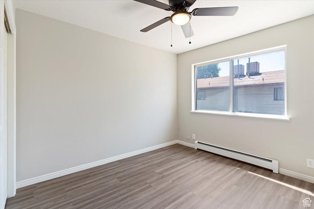 190 W 1100 N, Logan, UT 84341 - empty room with baseboard heating, wood finished floors, baseboards, and a ceiling fan