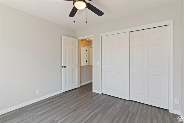 190 W 1100 N, Logan, UT 84341 - unfurnished bedroom with wood finished floors, baseboards, a closet, and a ceiling fan